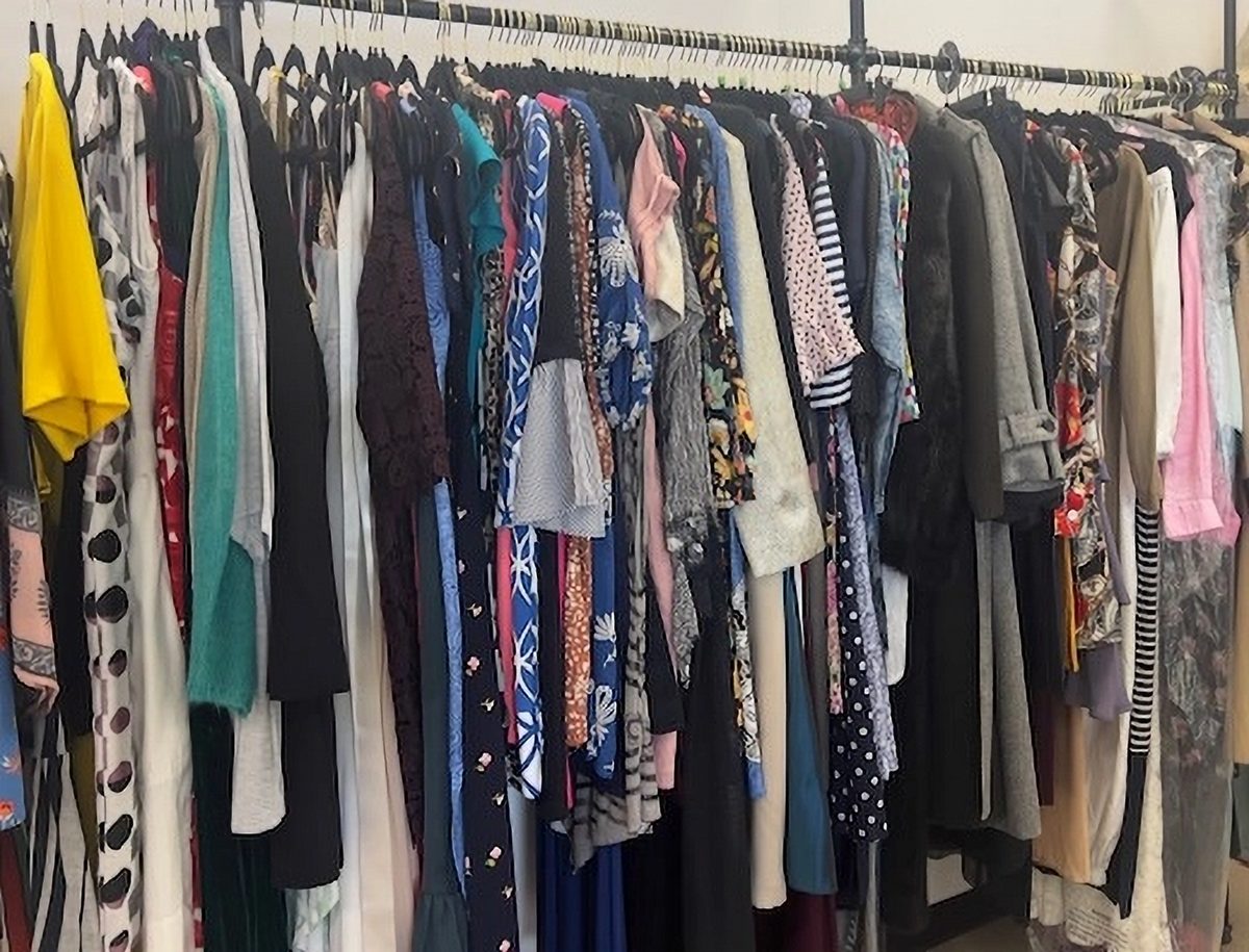 A selection of beautiful vintage and designer dresses for purchase at Thread Local 360, representing sustainable fashion choices.