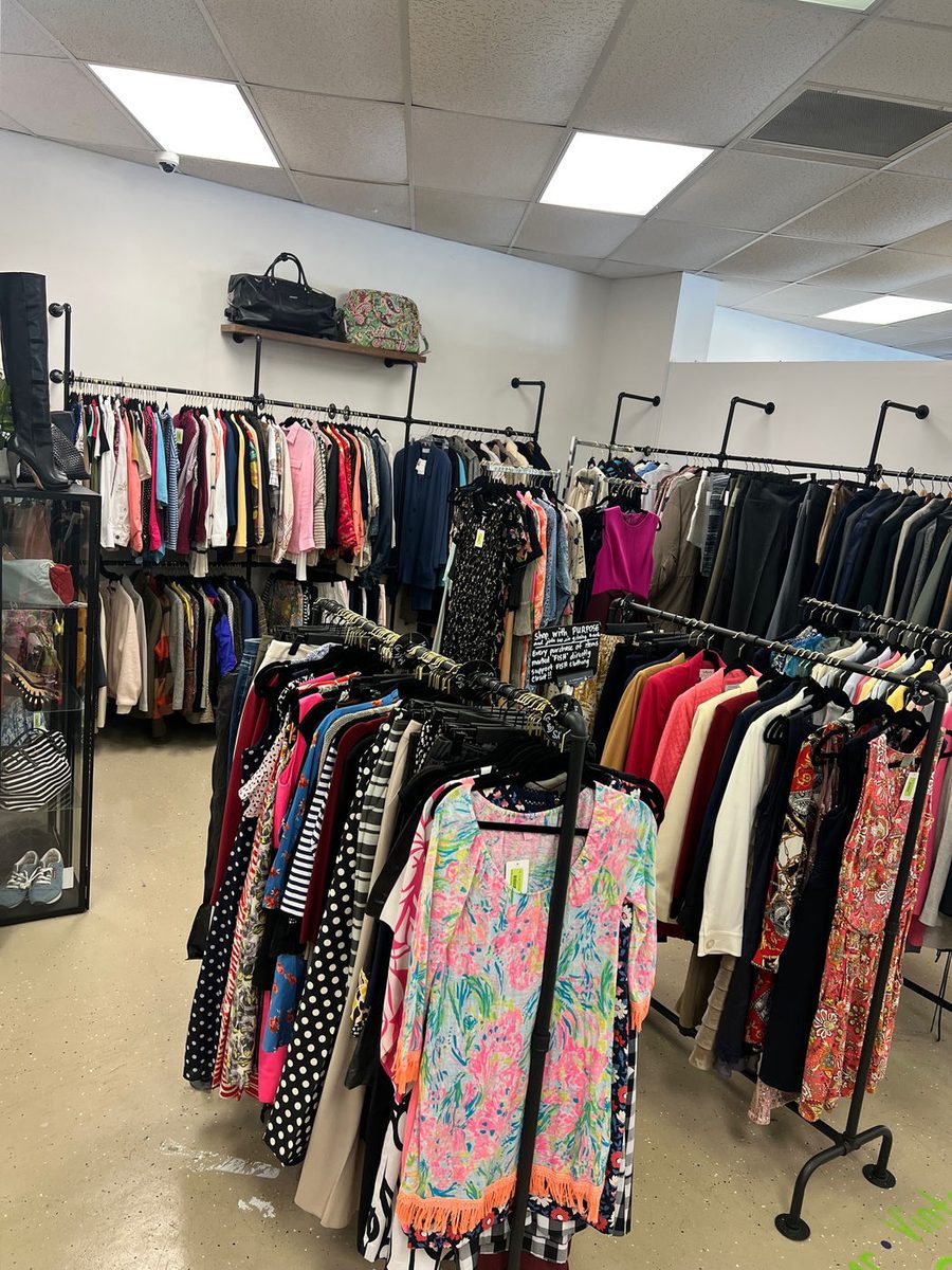 Consignment clothing arranged neatly for sale at Thread Local 360.