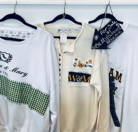A collection of upcycled Belly Buttons Boutique clothing, offered at Thread Local 360, highlighting creativity, sustainability, and support to local upcoming artisans.